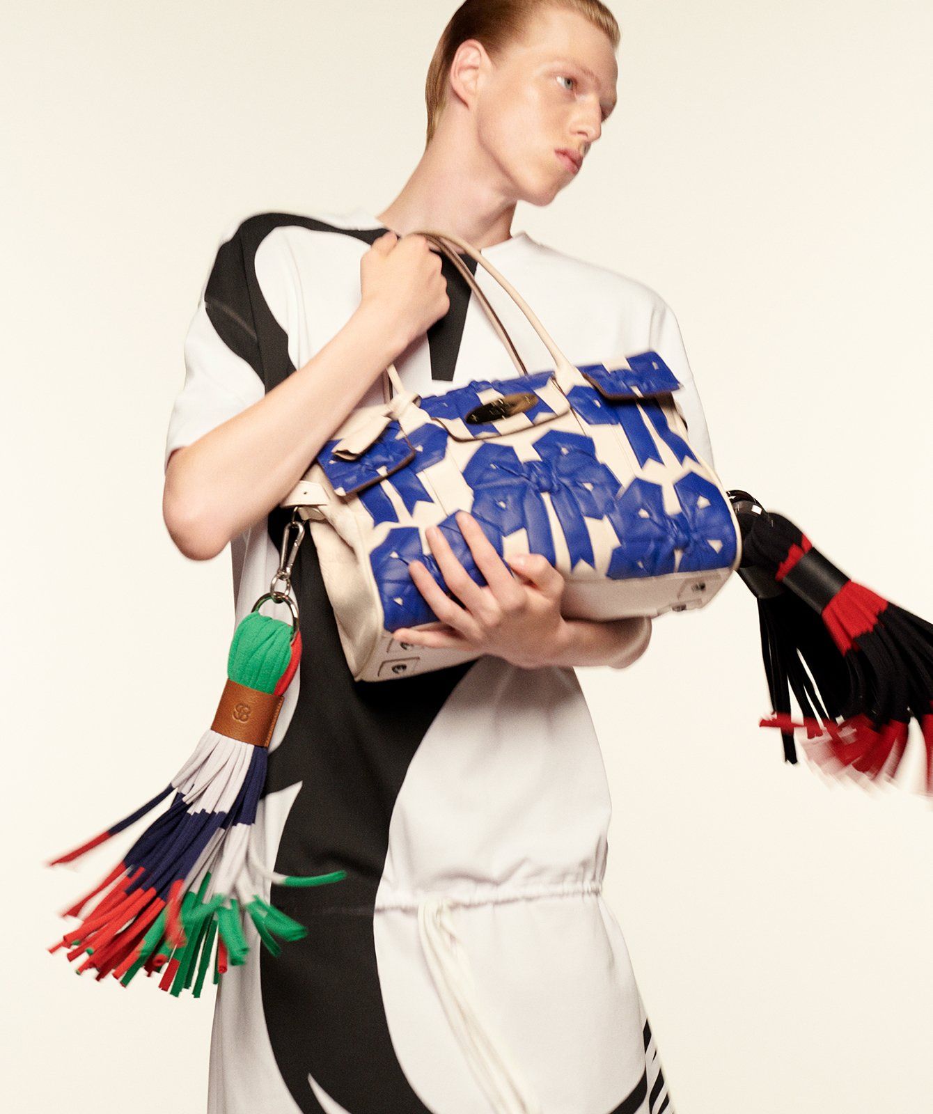 Model holding the Bayswater Bow 05 Handbag in Cream Spazzalato Leather with Tassels